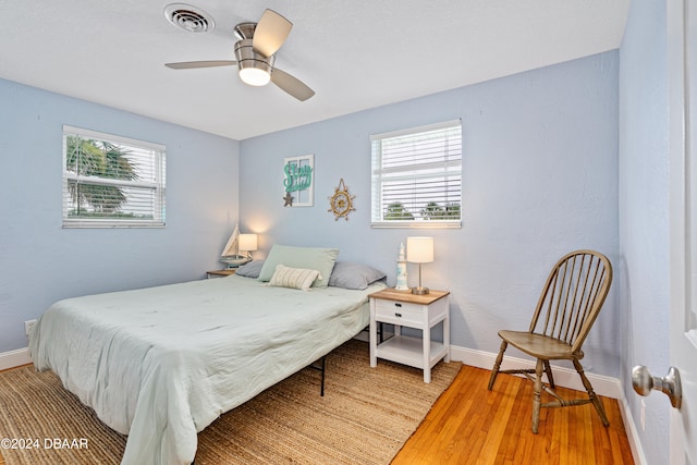 bedroom featuring ceiling fan and wood-type flooring