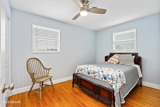 bedroom featuring ceiling fan and wood-type flooring