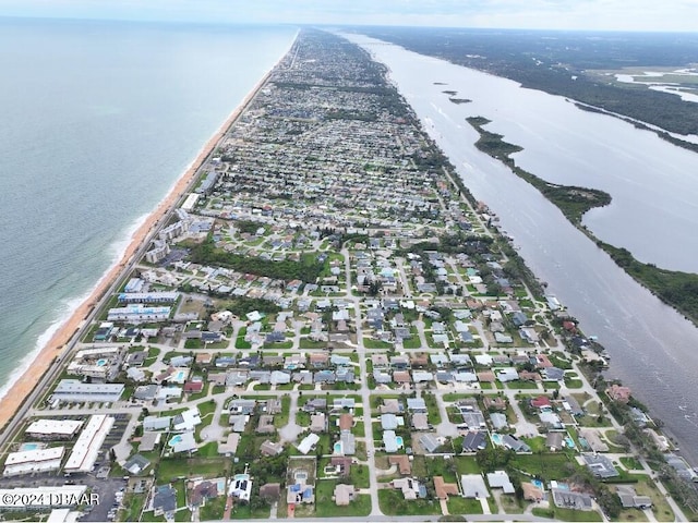 aerial view featuring a water view and a beach view