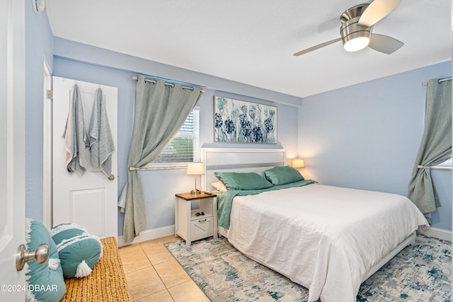 bedroom featuring ceiling fan and light tile patterned flooring