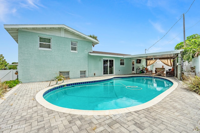 view of swimming pool with a patio area