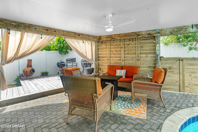 view of patio / terrace with outdoor lounge area, ceiling fan, and a wooden deck