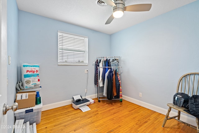 miscellaneous room with light hardwood / wood-style floors and ceiling fan