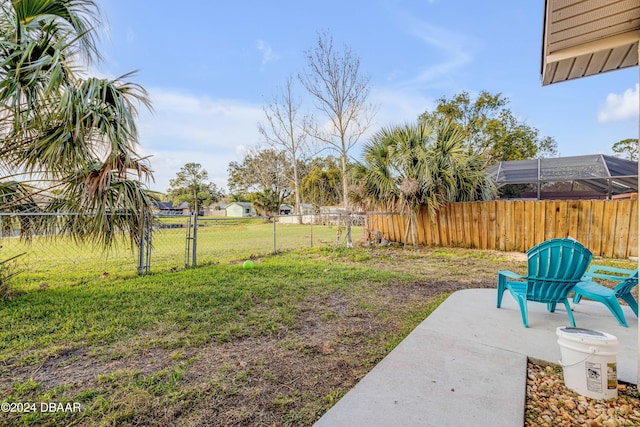 view of yard with a patio area, a gate, and fence