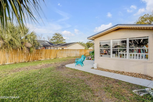 view of yard with a patio area and fence