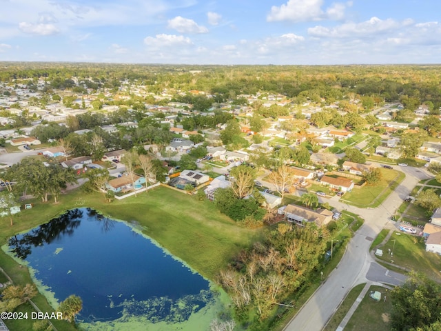 birds eye view of property with a water view and a residential view