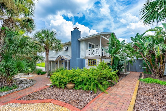 4026 Cardinal Blvd, Wilbur-By-The-Sea, FL 32127 - back of house featuring a balcony and a chimney