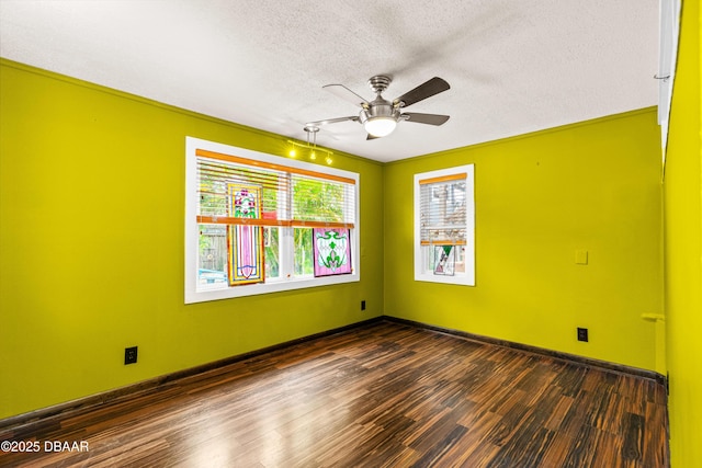 4026 Cardinal Blvd, Wilbur-By-The-Sea, FL 32127 - unfurnished room featuring dark wood finished floors, a ceiling fan, and a textured ceiling