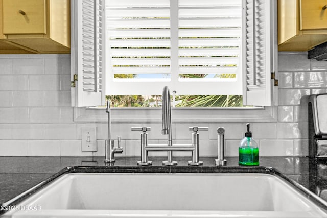 4026 Cardinal Blvd, Wilbur-By-The-Sea, FL 32127 - kitchen view of tasteful backsplash and dark stone countertops