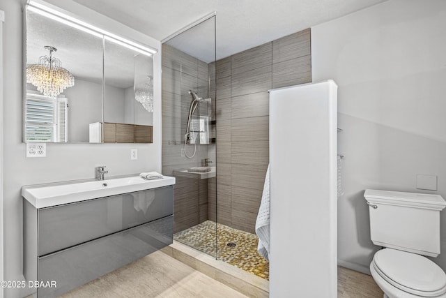 4026 Cardinal Blvd, Wilbur-By-The-Sea, FL 32127 - bathroom featuring tiled shower, vanity, and a chandelier