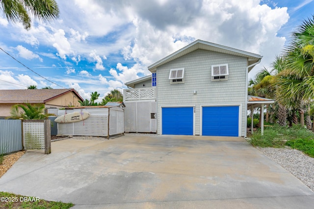 4026 Cardinal Blvd, Wilbur-By-The-Sea, FL 32127 - back of property with an attached garage and concrete driveway