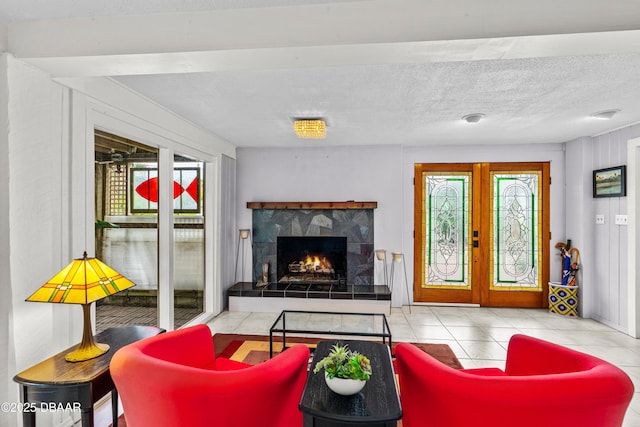 4026 Cardinal Blvd, Wilbur-By-The-Sea, FL 32127 - tiled living area with a fireplace, french doors, and a textured ceiling