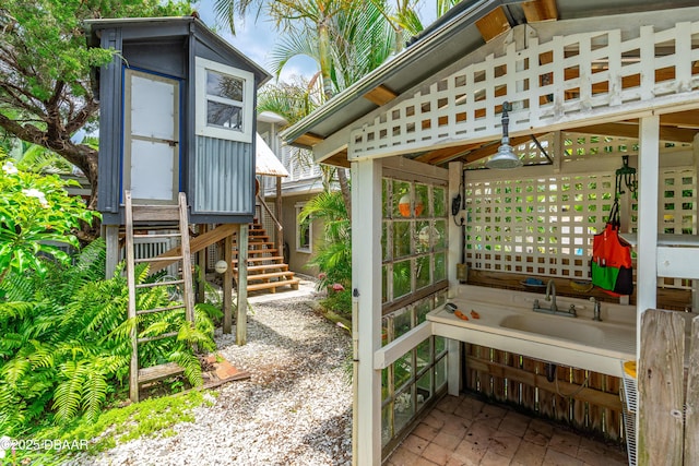 4026 Cardinal Blvd, Wilbur-By-The-Sea, FL 32127 - wooden deck featuring stairs and a sink