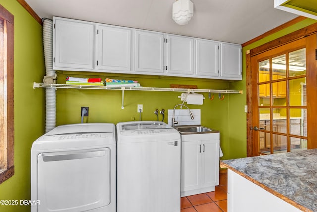 4026 Cardinal Blvd, Wilbur-By-The-Sea, FL 32127 - laundry room featuring cabinet space, washing machine and clothes dryer, and light tile patterned flooring