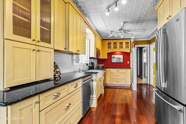 4026 Cardinal Blvd, Wilbur-By-The-Sea, FL 32127 - kitchen featuring appliances with stainless steel finishes, light brown cabinetry, dark wood-style floors, tasteful backsplash, and an ornate ceiling