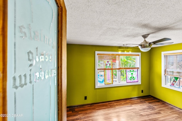 4026 Cardinal Blvd, Wilbur-By-The-Sea, FL 32127 - spare room featuring a textured ceiling, wood finished floors, and ceiling fan