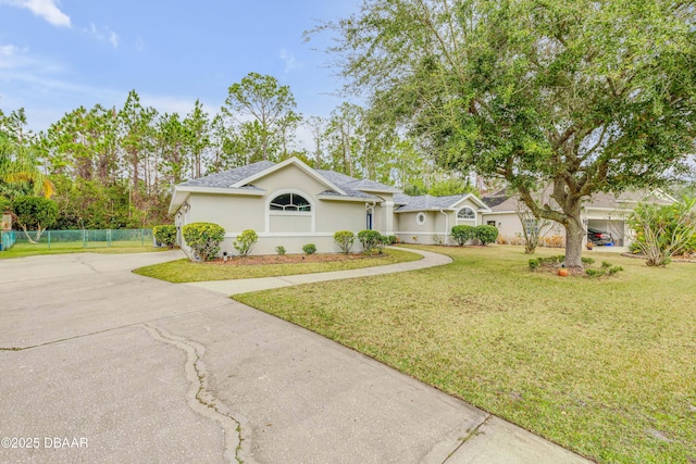 single story home with a front lawn and a garage