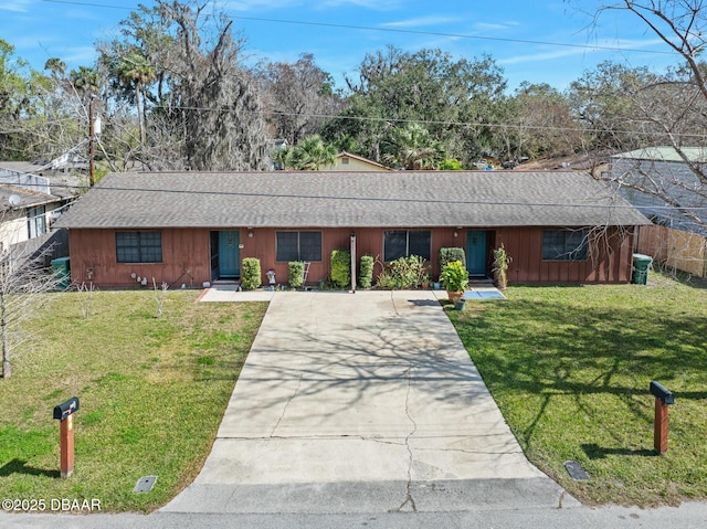 ranch-style house featuring a front yard