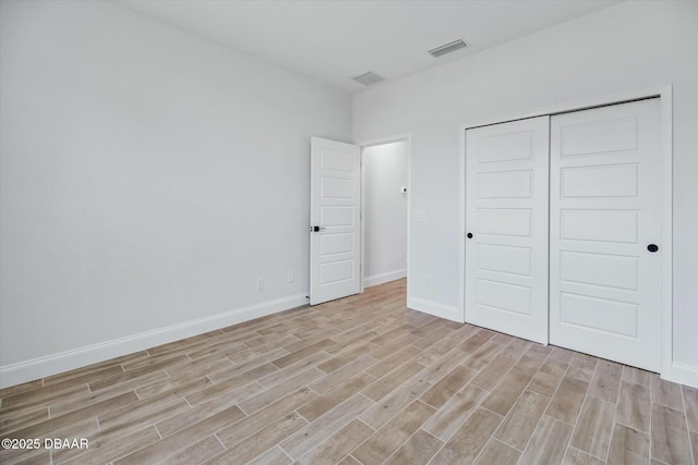 unfurnished bedroom with a closet