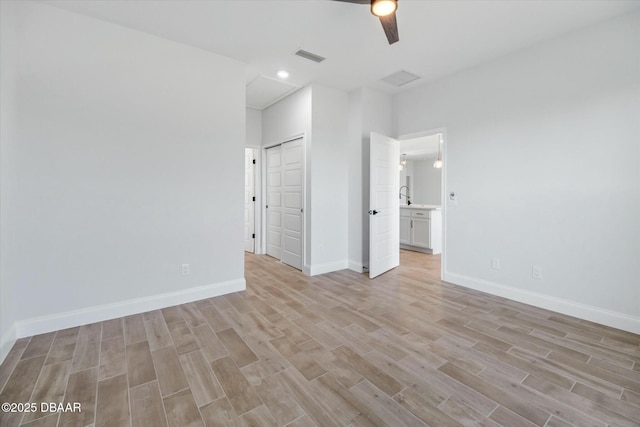 unfurnished bedroom featuring light hardwood / wood-style flooring and ceiling fan