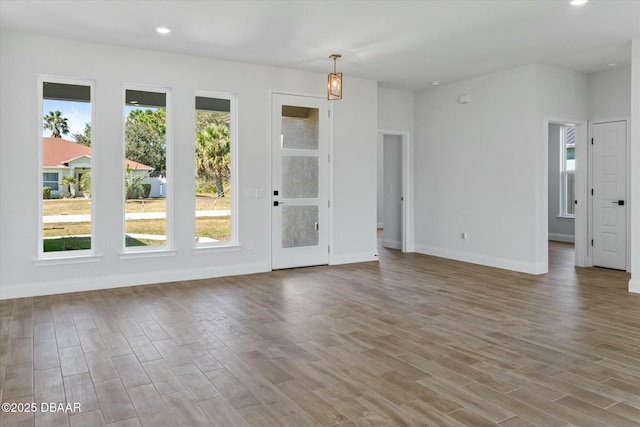 unfurnished room with light wood-type flooring