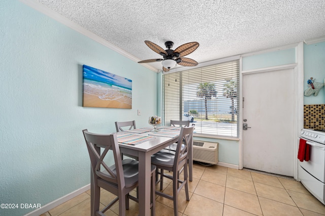 dining space with ceiling fan, a textured ceiling, crown molding, and light tile patterned floors