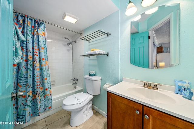 full bathroom featuring vanity, shower / bath combo with shower curtain, tile patterned flooring, and toilet