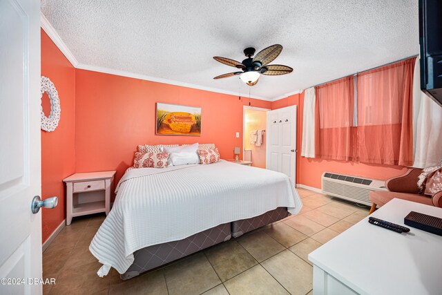 tiled bedroom featuring ceiling fan, a textured ceiling, crown molding, and a wall mounted air conditioner