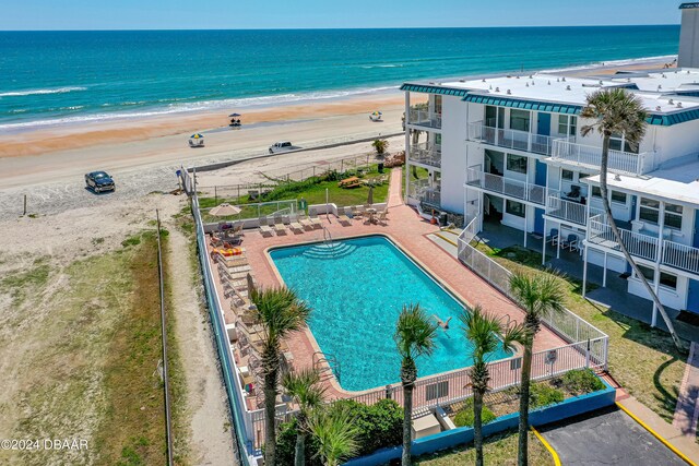 aerial view with a beach view and a water view