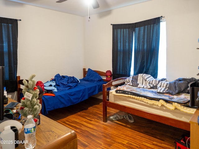 bedroom featuring wood finished floors and ceiling fan