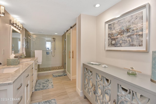 bathroom featuring an enclosed shower and vanity