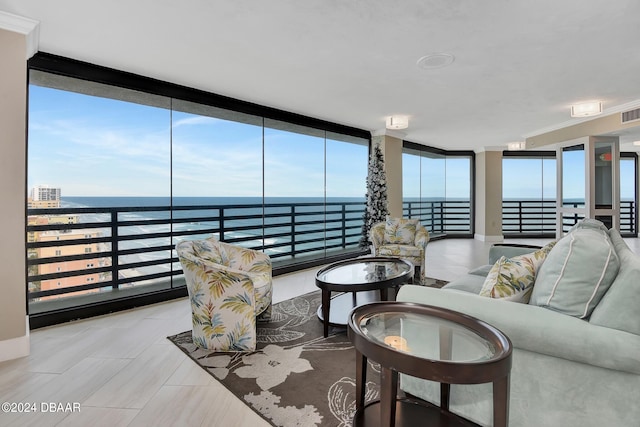 living room with plenty of natural light and a water view