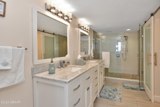 bathroom featuring vanity, wood-type flooring, and a shower with door