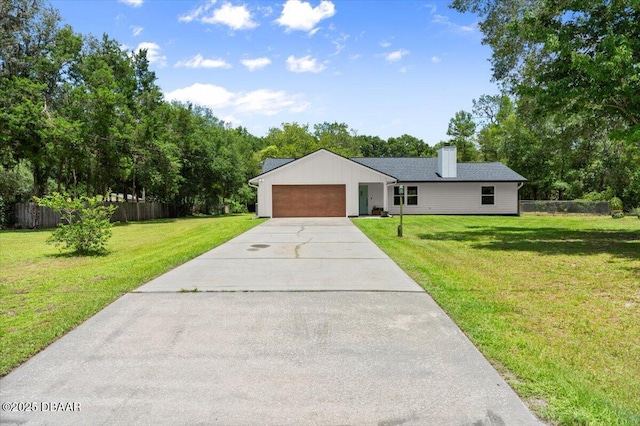 2455 Whooping Crane Dr, Deleon Springs, FL 32130 - ranch-style home featuring concrete driveway, a garage, and a chimney
