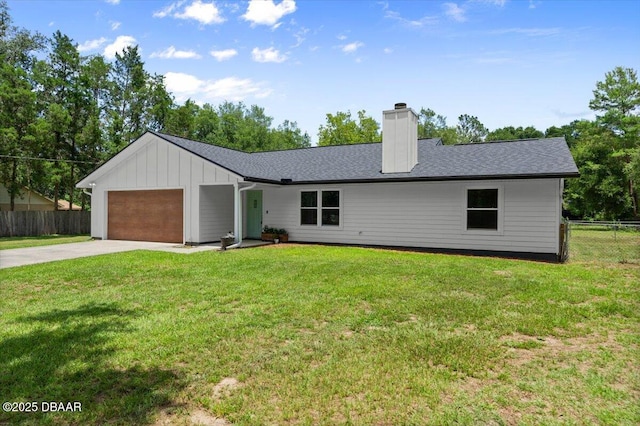2455 Whooping Crane Dr, Deleon Springs, FL 32130 - view of front of property with concrete driveway, a garage, a chimney, and board and batten siding