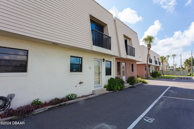 3750 S Atlantic Ave Unit 180, Daytona Beach Shores, FL 32118 - view of building exterior with uncovered parking and a residential view