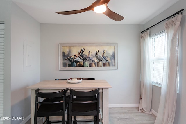 dining space featuring ceiling fan and light hardwood / wood-style flooring