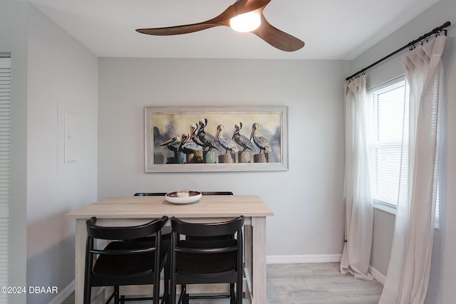 3750 S Atlantic Ave Unit 180, Daytona Beach Shores, FL 32118 - dining area featuring a ceiling fan, baseboards, and light wood-style floors