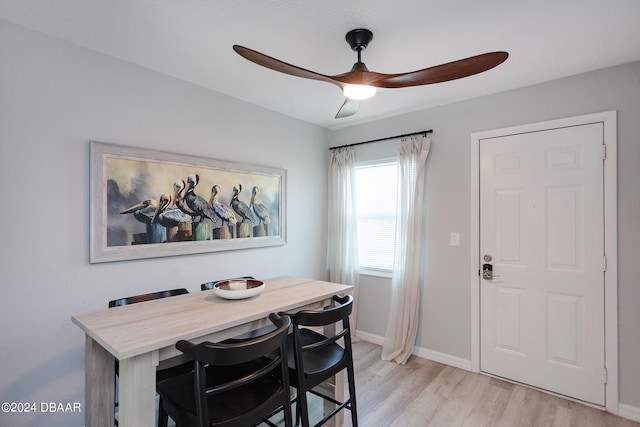 dining area featuring ceiling fan and light hardwood / wood-style flooring