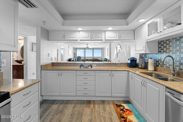 kitchen featuring white cabinetry, stainless steel dishwasher, dark hardwood / wood-style flooring, and sink