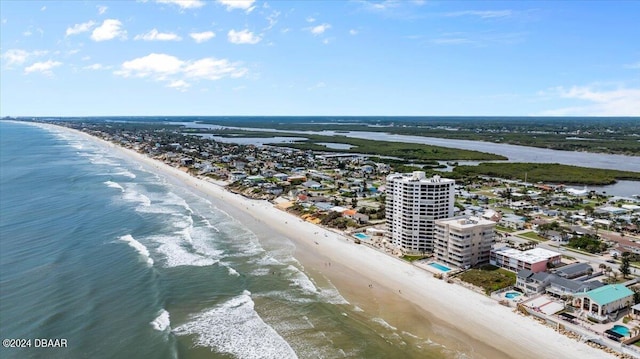 birds eye view of property with a view of the beach and a water view