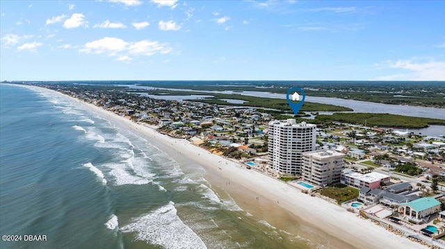 aerial view featuring a view of the beach and a water view