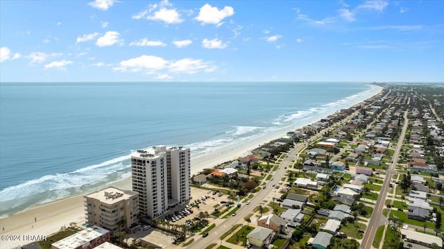 bird's eye view featuring a beach view and a water view