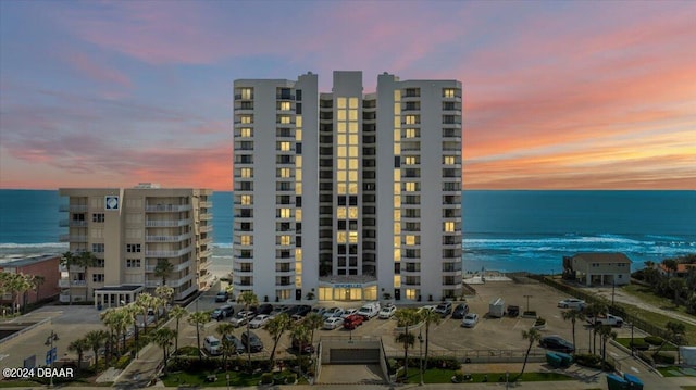 outdoor building at dusk featuring a water view