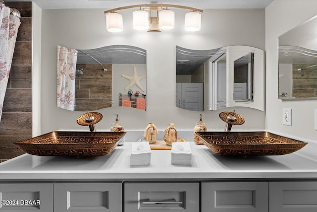 bathroom featuring curtained shower and vanity