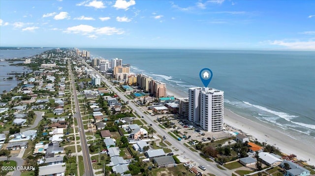 aerial view featuring a view of the beach and a water view