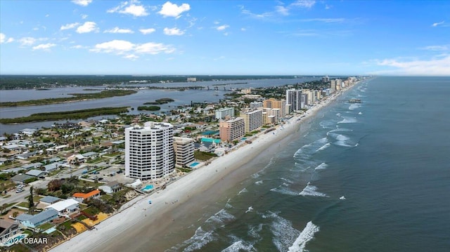 birds eye view of property featuring a view of the beach and a water view