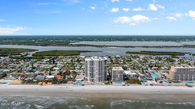 birds eye view of property featuring a water view and a view of the beach