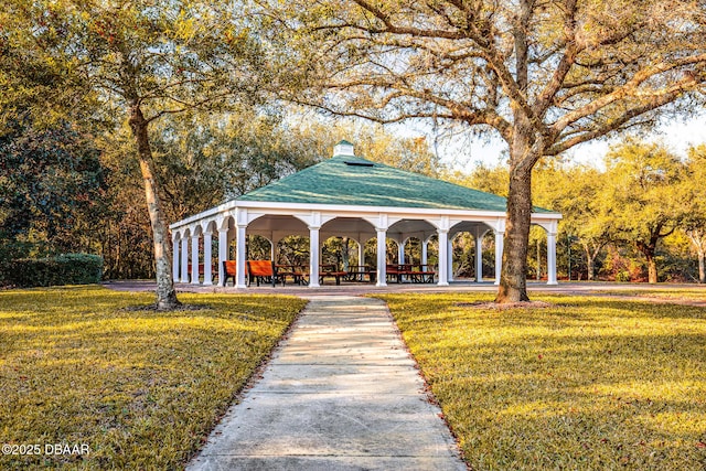 view of property's community with a gazebo and a yard