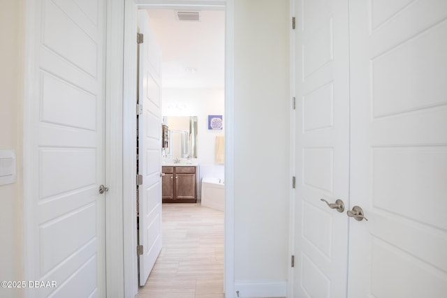 hall featuring sink